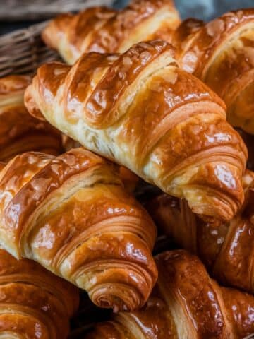 Golden and Flaky Gipfeli Recipe: A basket filled with beautifully baked, golden brown Gipfeli, showcasing their flaky layers and buttery texture, perfect for breakfast or a snack.