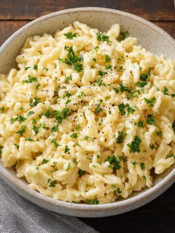 Homemade Spaetzle served in a bowl, showcasing the soft, tender texture of the dumplings.