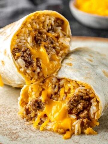 Taco Bell Beefy Melt Burrito wrapped in a flour tortilla with rice and beef filling.